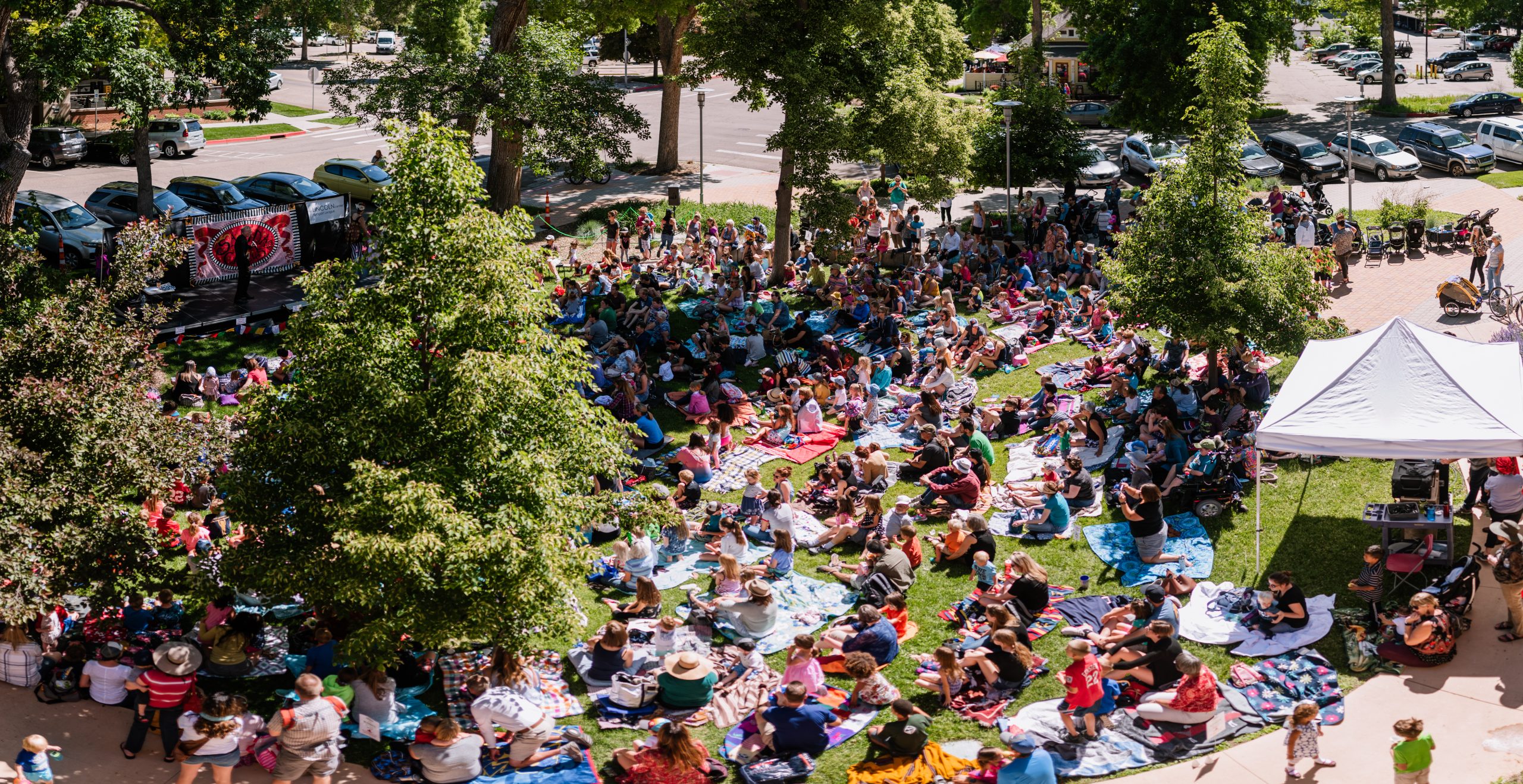 A shot from the rooftop deck of the Children's Summer series. The lawn is at full capacity.